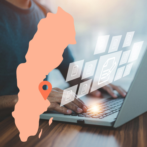 Karta över Sverige och dator i bakgrunden
