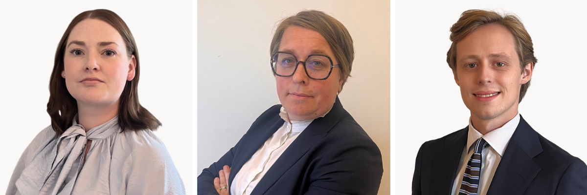 Tre personer i kostym och slips poserar f&ouml;r en bild.