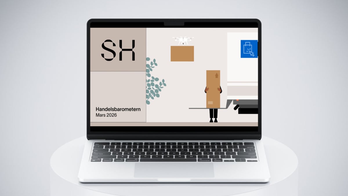 En bärbar dator som sitter på ett vitt bord.