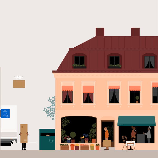 En man cyklar längs en gata bredvid en hög byggnad.