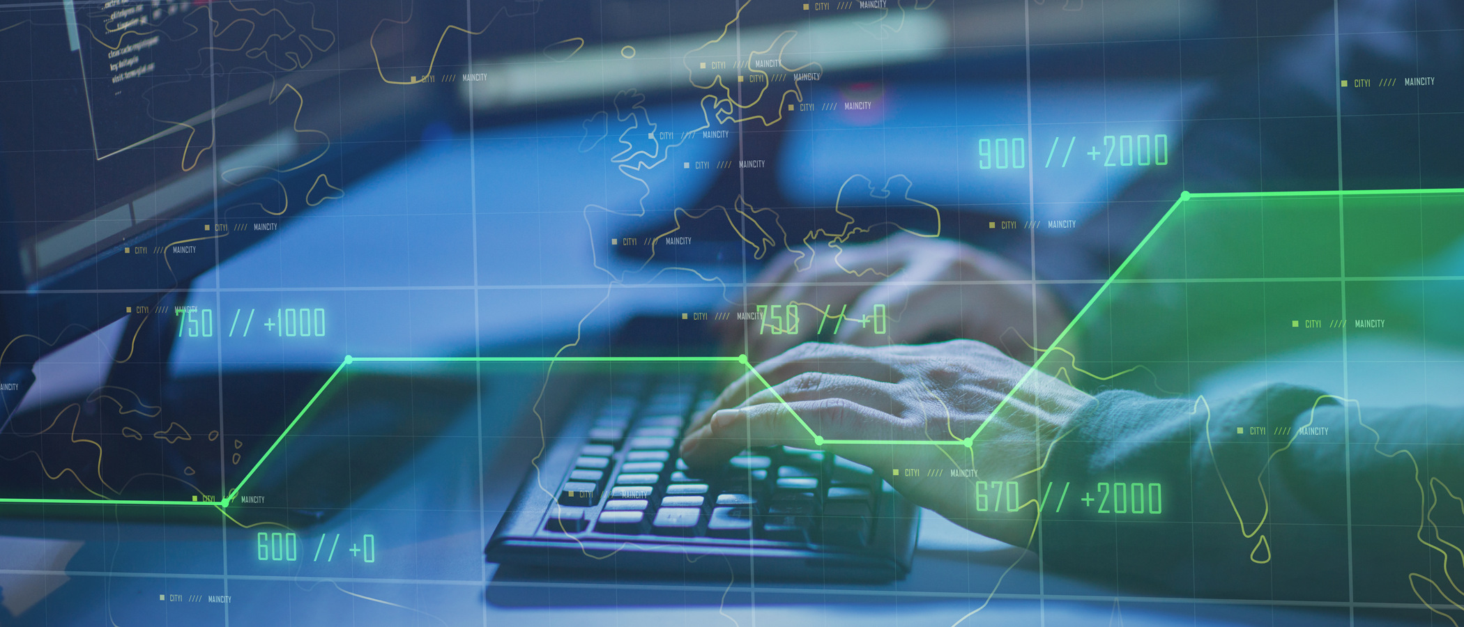 En person som skriver på ett tangentbord framför en bildskärm.